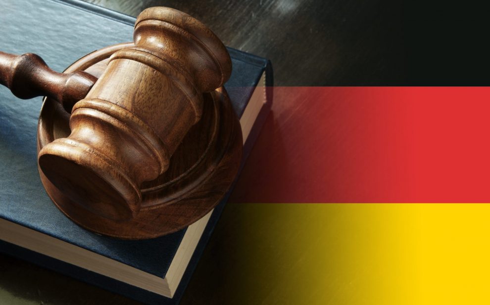 gavel,and,legal,book,on,wooden,table,,collage,with,german