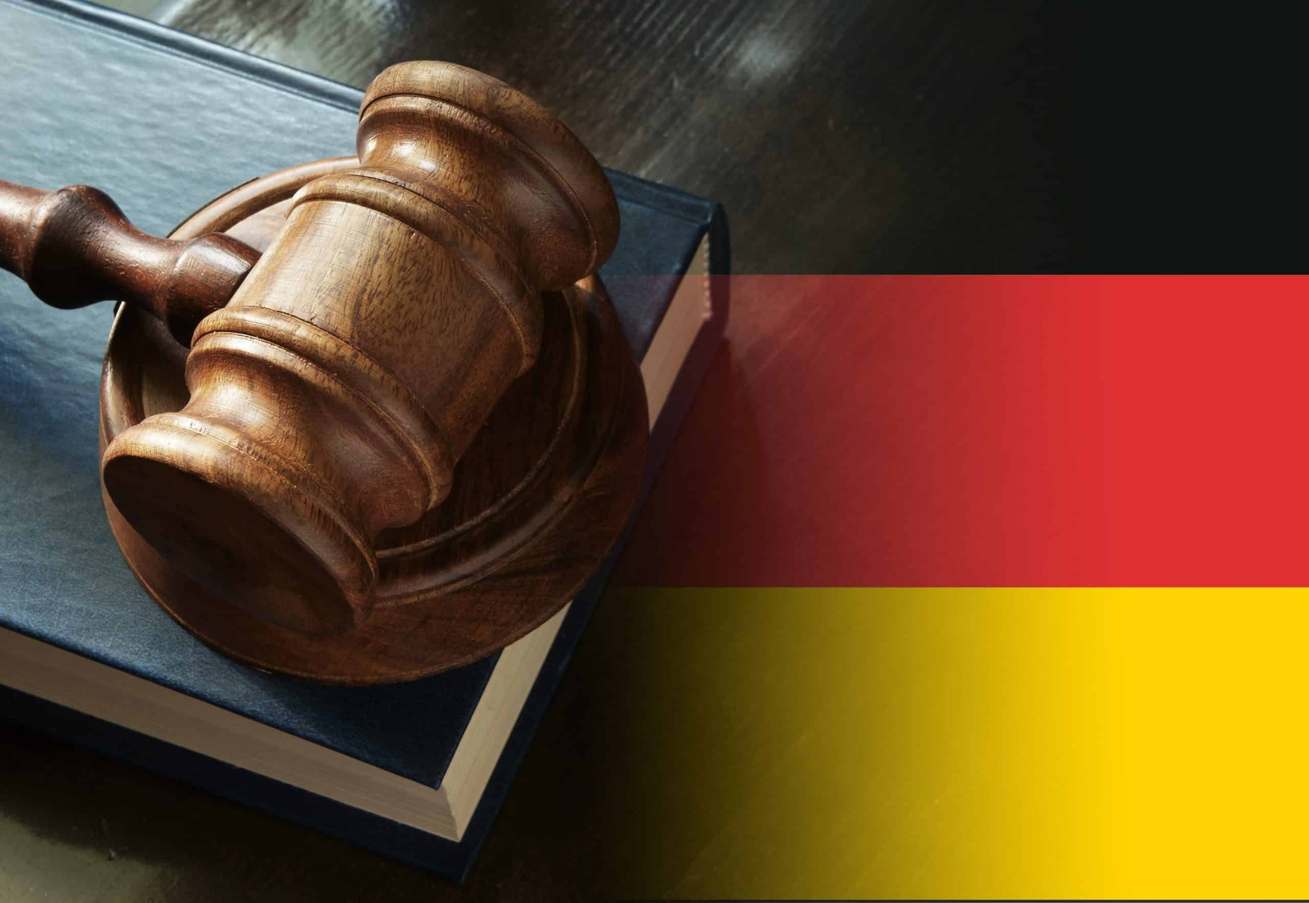 gavel,and,legal,book,on,wooden,table,,collage,with,german